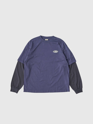 【SEDAN ALL - PURPOSE|セダンオールパーパス】OVAL LOGO LAYERED TEE/オーバルロゴレイヤードL/S Tシャツ(NAVY/CHARCOAL) - STREAM【SEDAN ALL - PURPOSE|セダンオールパーパス】OVAL LOGO LAYERED TEE/オーバルロゴレイヤードL/S Tシャツ(NAVY/CHARCOAL)STREAMM