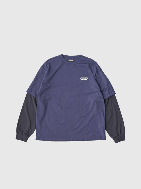 【SEDAN ALL-PURPOSE|セダンオールパーパス】OVAL LOGO LAYERED TEE/オーバルロゴレイヤードL/S Tシャツ(NAVY/CHARCOAL)
